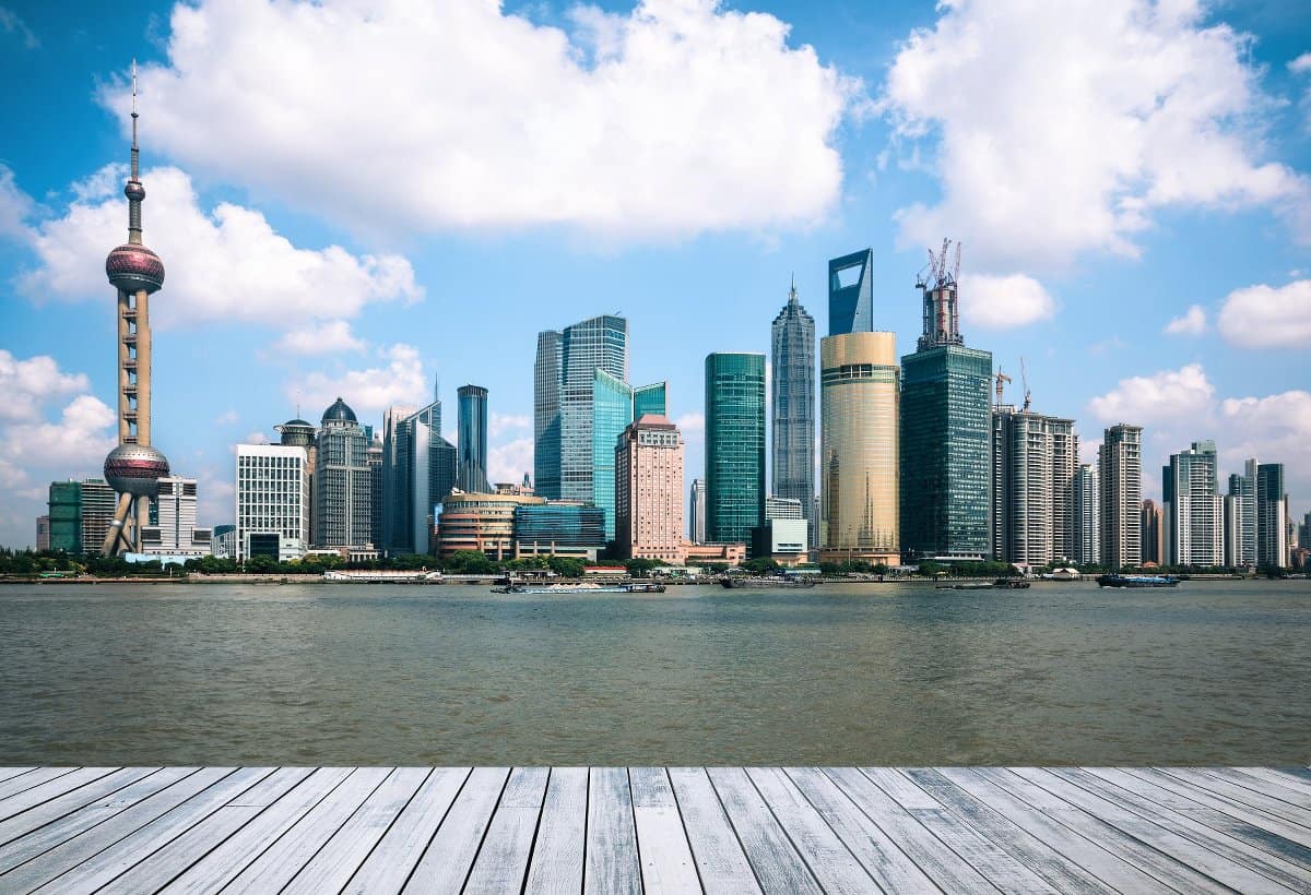 shanghai skyline against a blue sky with wooden floor